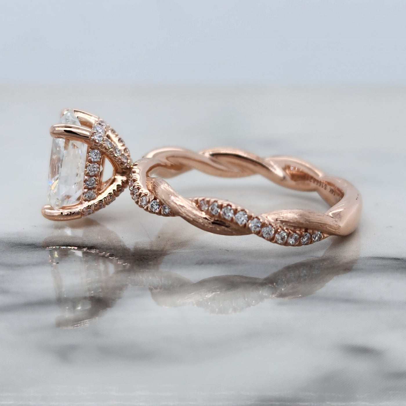 Rose Gold Engagement Ring With Oval Diamond Center and Distressed Finish