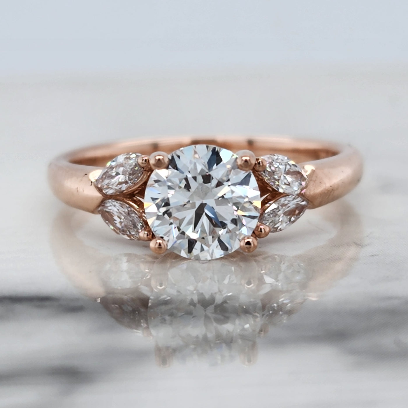 Rose Gold Engagement Ring With Round Center Diamond and Marquise Accent Diamonds