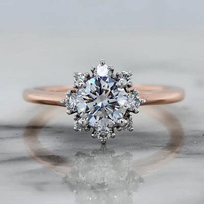 Rose Gold Engagement Ring With Round Center Stone, Star Shaped Halo and Round Accent Stones