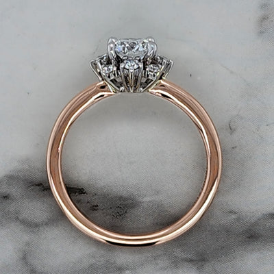 Rose Gold Engagement Ring With Round Center Stone, Star Shaped Halo and Round Accent Stones