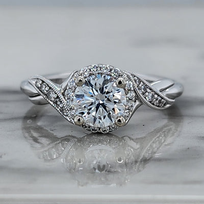 White Gold Engagement Ring With Accent Diamonds and Floral Detail