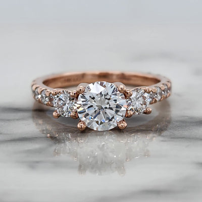 Rose Gold Round 3 Stone Engagement Ring With Diamond Accents