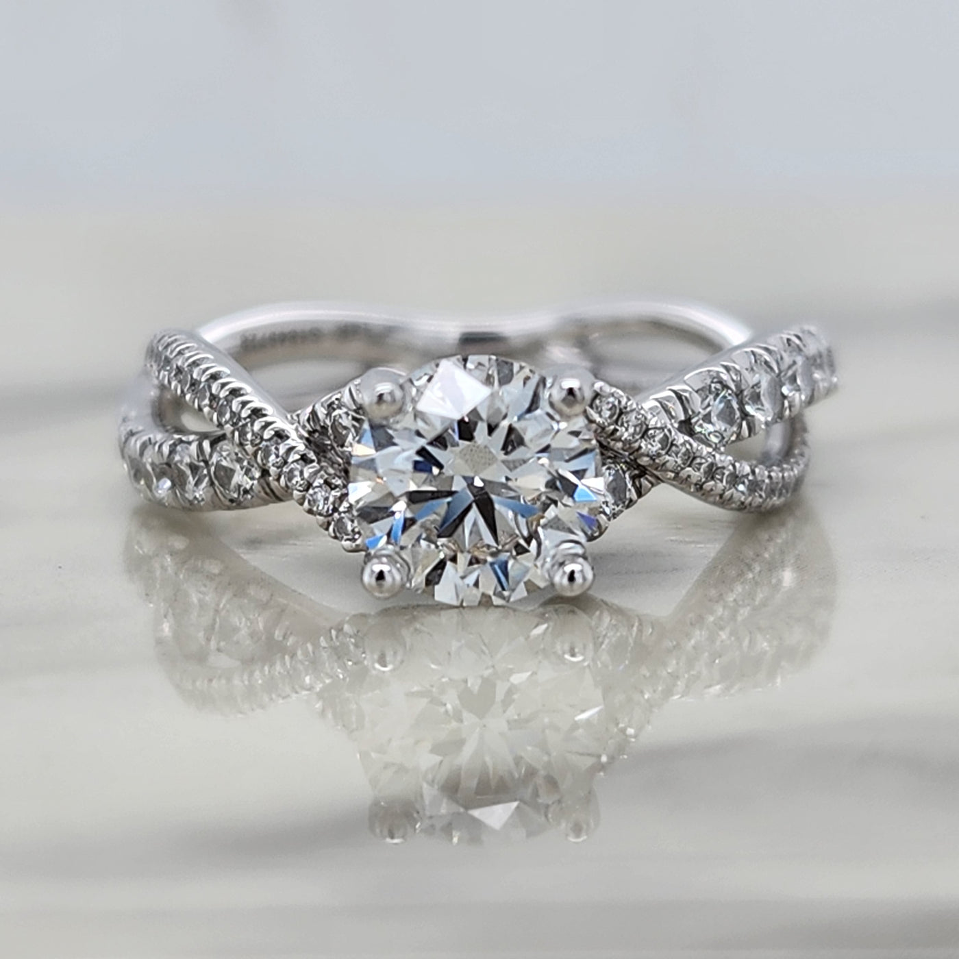 Twisted White Gold Round Engagement Ring With Round Diamond Accents