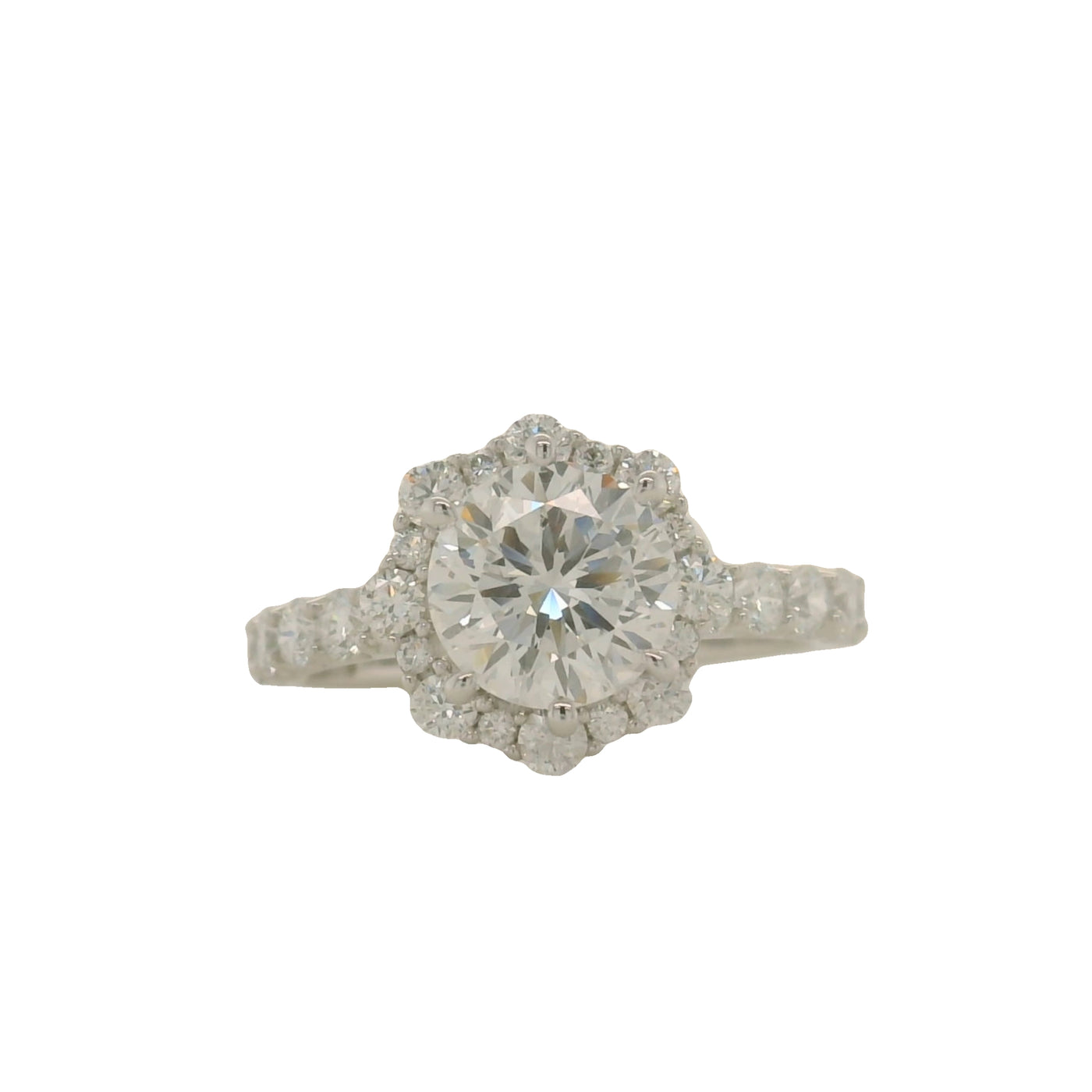 white gold round engagement ring with floral shaped halo and accent diamonds