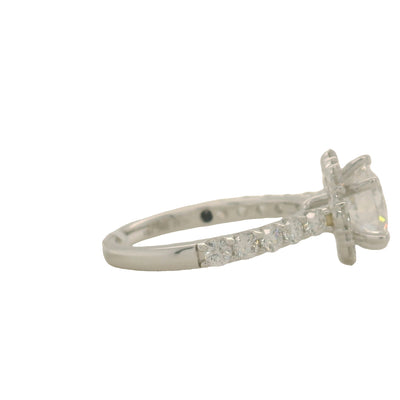 white gold round engagement ring with floral shaped halo and accent diamonds