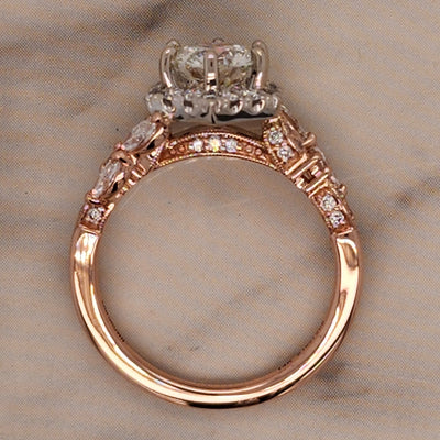 2 tone rose and white gold engagement ring with hexagon halo and marquise accents