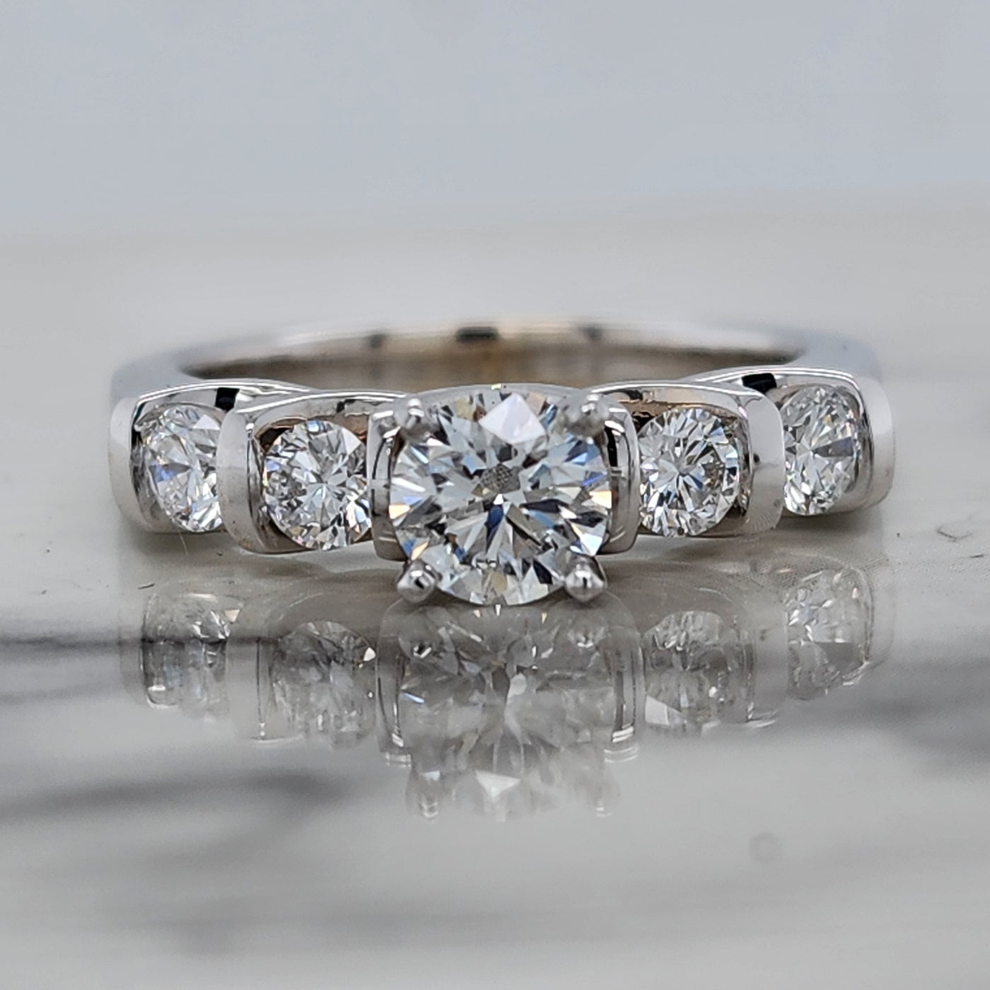 White Gold Engagement Ring With Round Center and Round Channel Set Accent Stones
