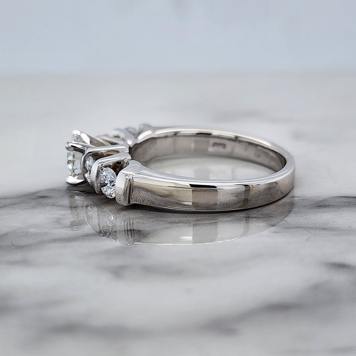 White Gold Engagement Ring With Round Center and Round Channel Set Accent Stones