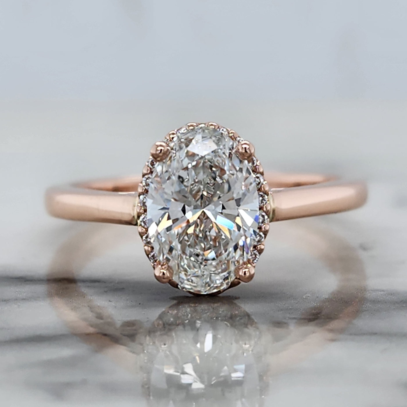 Custom Rose Gold Engagement Ring With Oval Center Stone and Diamond Halo