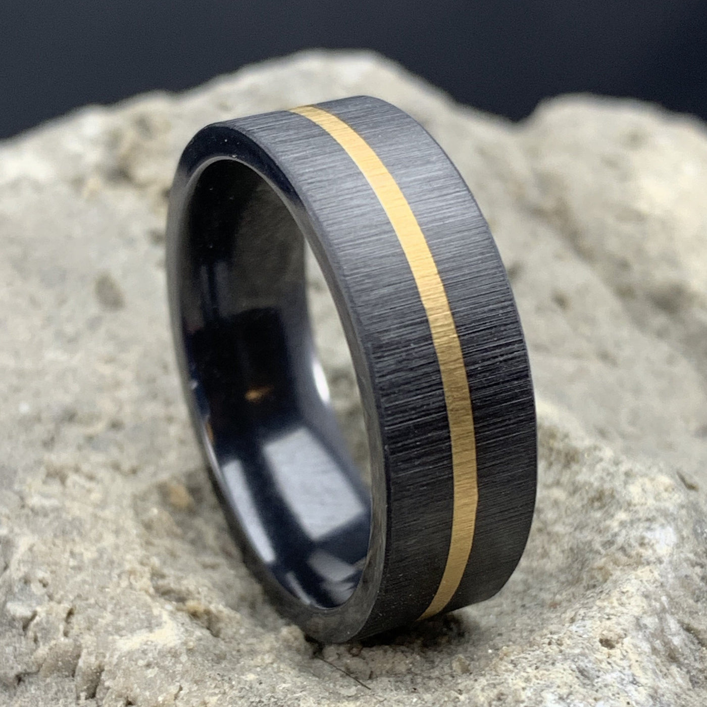 zirconium wedding band with yellow gold inlay and brushed finish