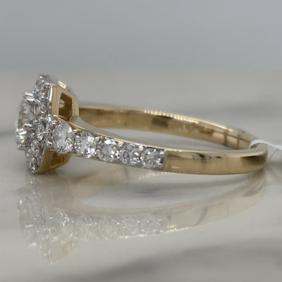 yellow gold hexagon halo engagement ring with round center stone and round accent diamonds