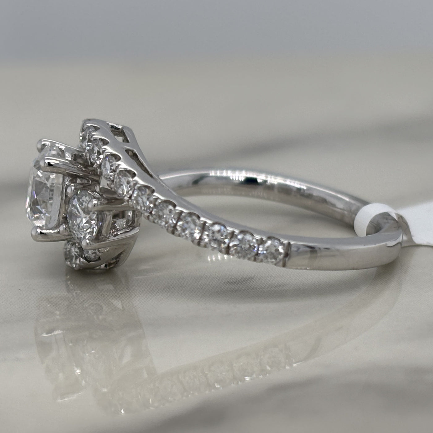 white gold 3 stone round engagement ring with accent diamonds