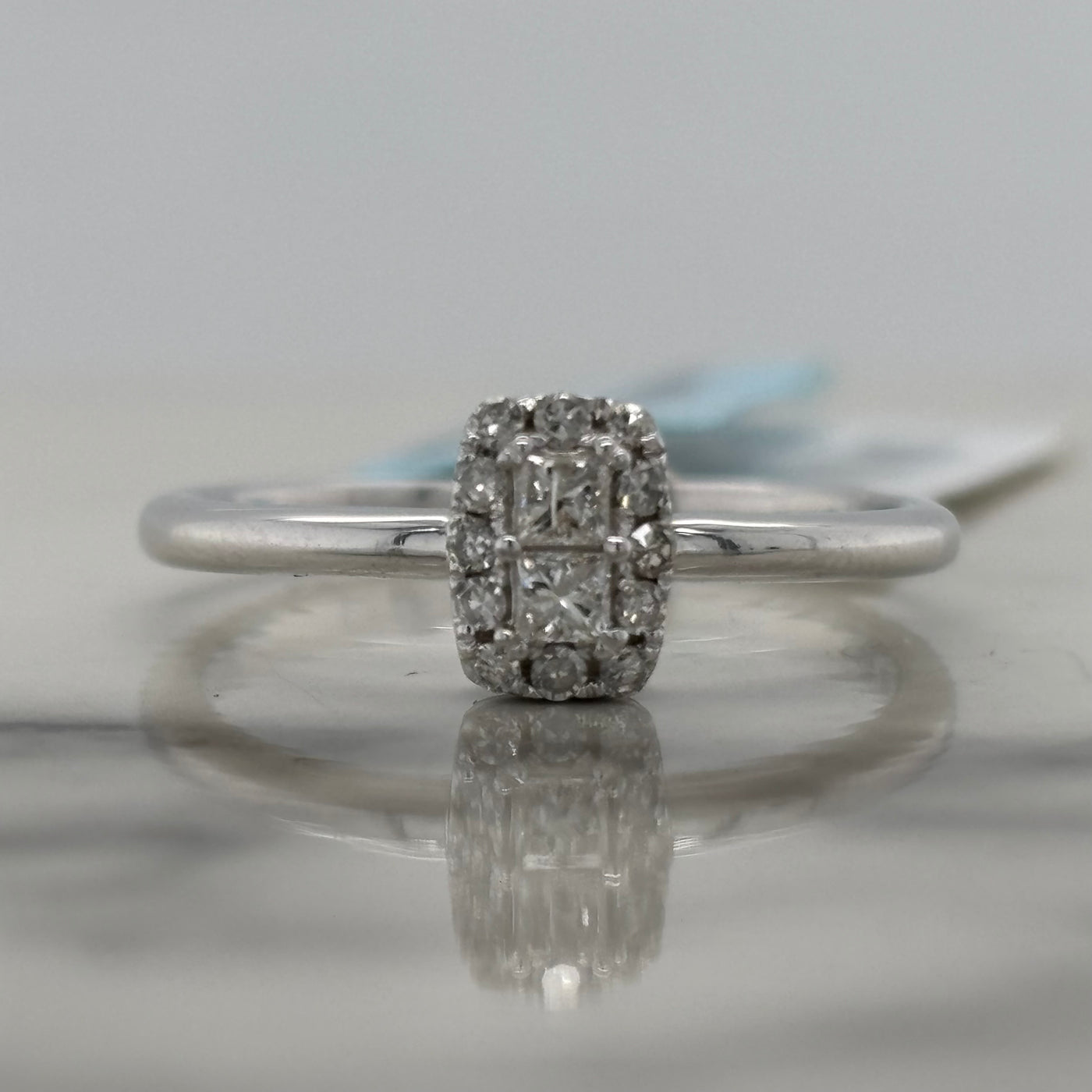 white gold diamond cluster solitaire engagement ring