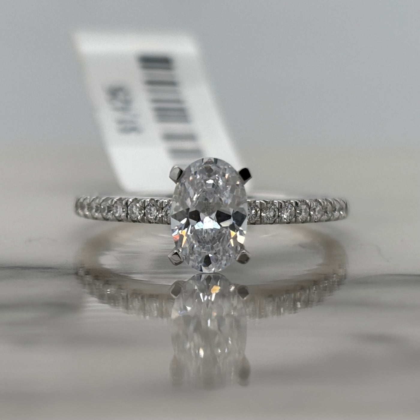 14k white gold semi mount engagement ring with oval center stone and diamond accent stones
