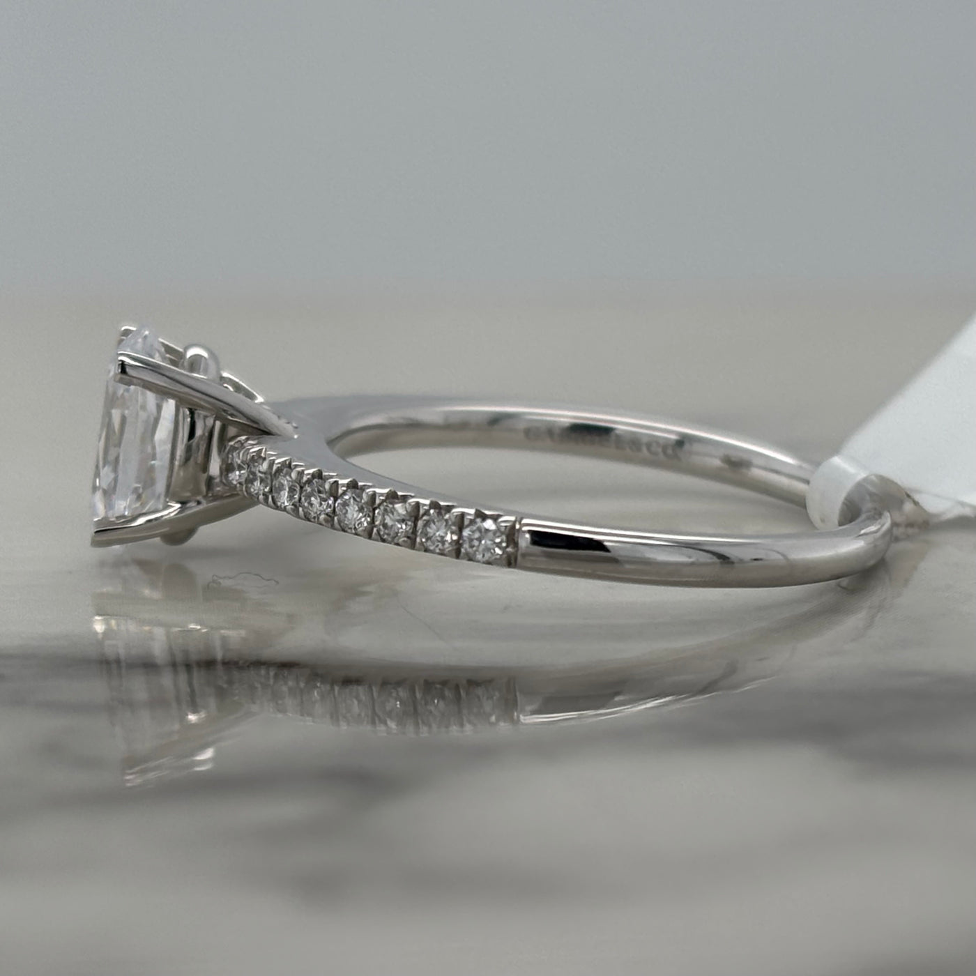 14k white gold semi mount engagement ring with oval center stone and diamond accent stones