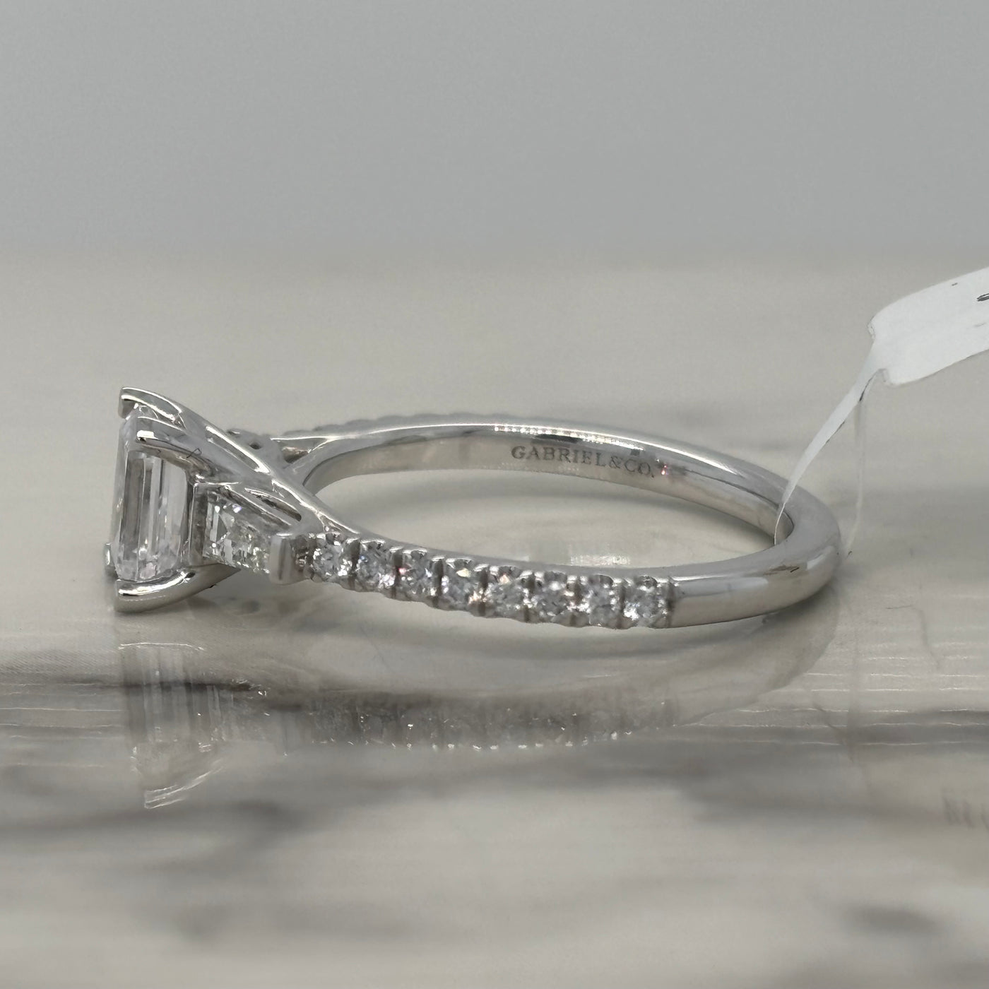 White Gold Emerald cut Engagement ring with baguette side stones and round accent diamonds