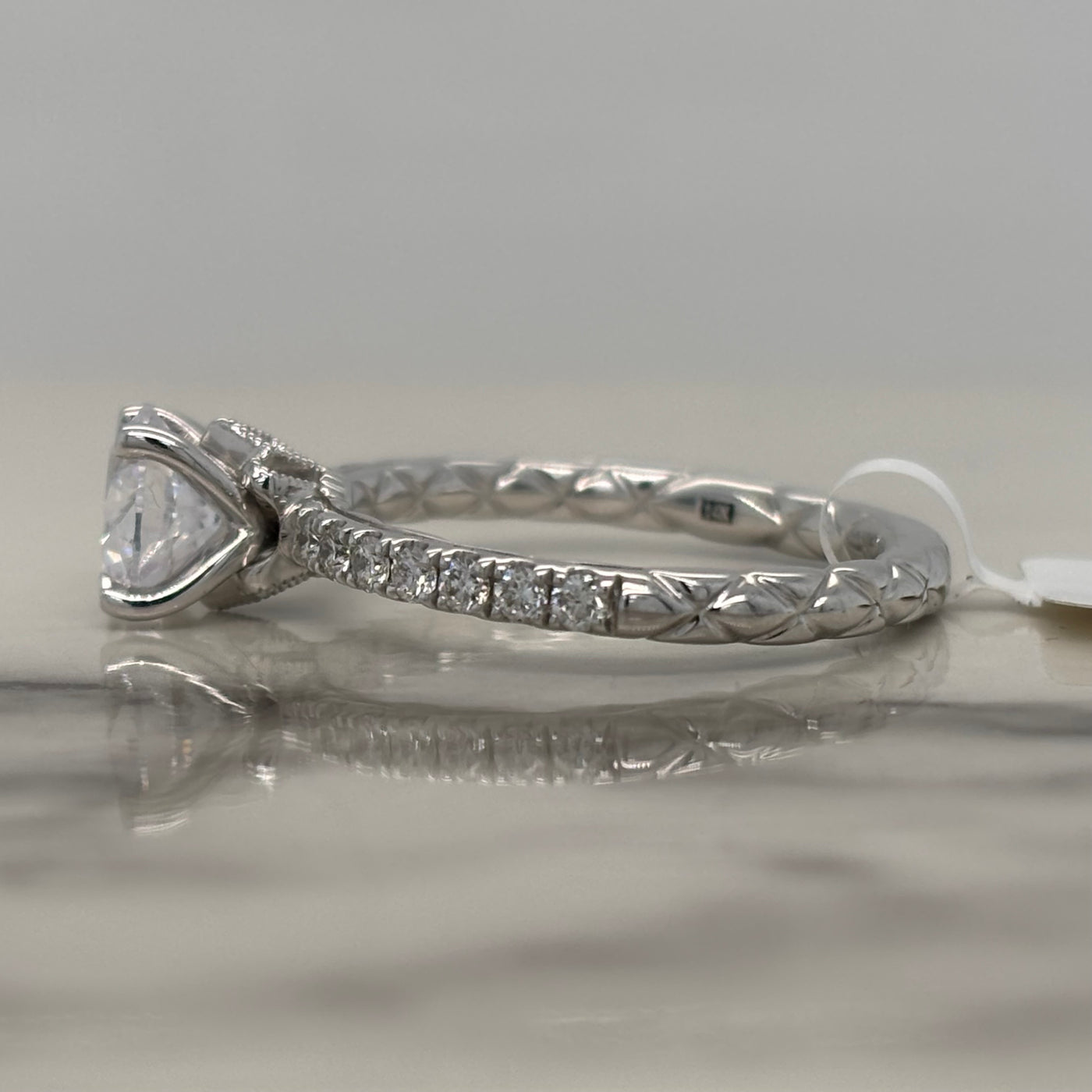 14k white gold round engagement ring with round accent diamonds