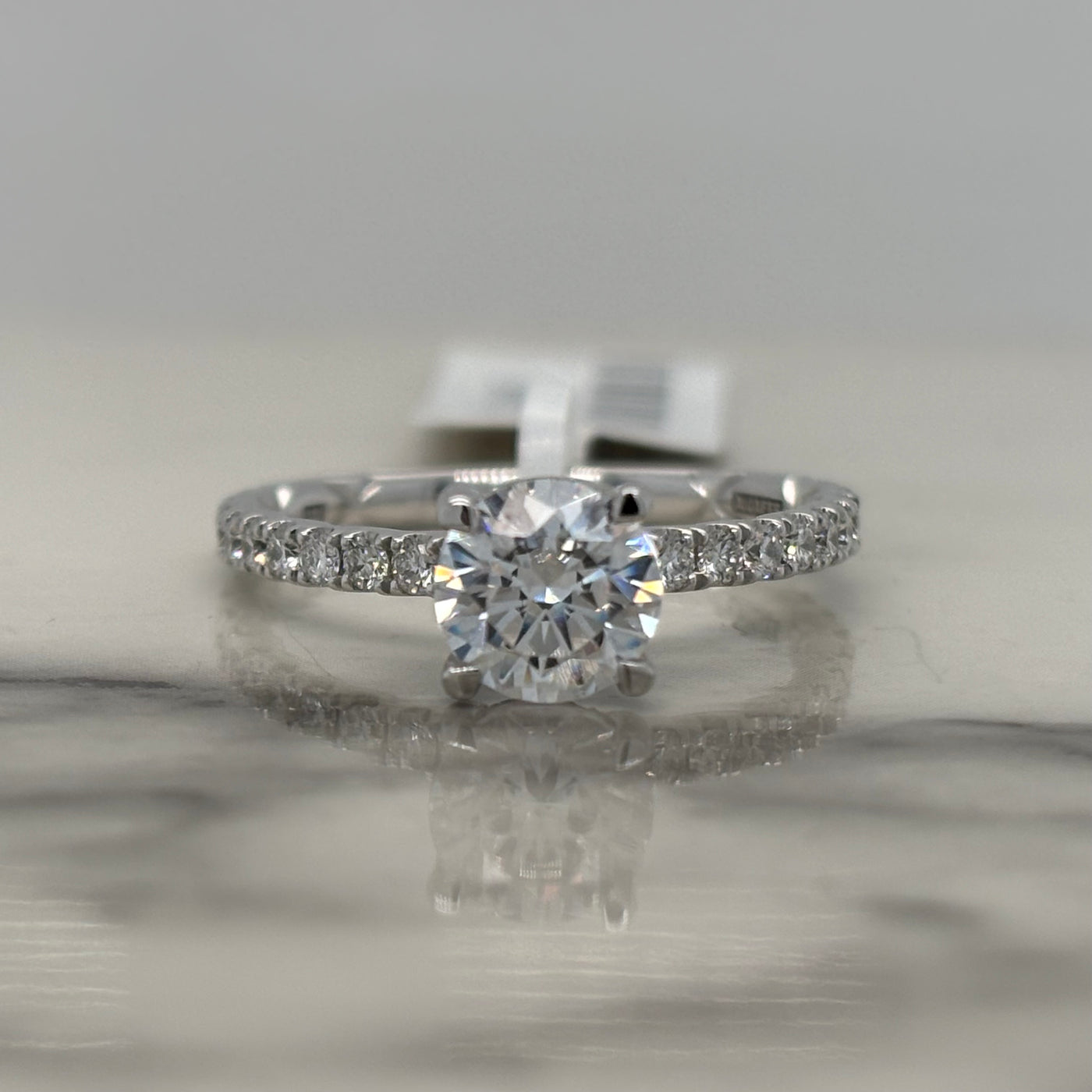 14k round white gold engagement ring with hidden halo and accent diamonds