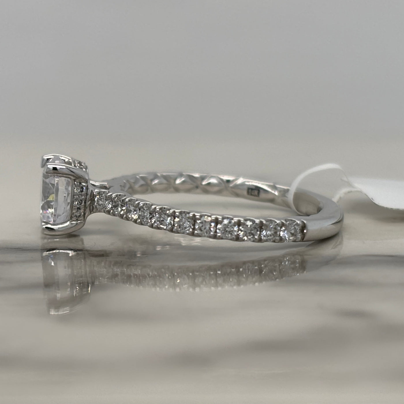 14k round white gold engagement ring with hidden halo and accent diamonds