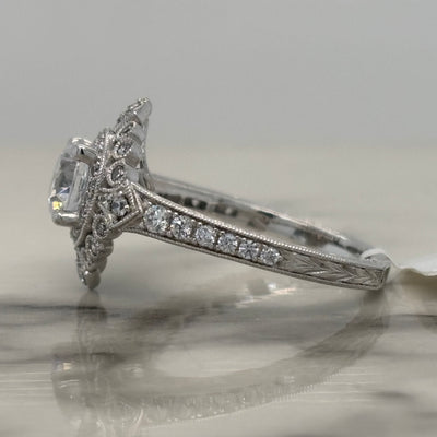 white gold vintage style round engagement ring with accent diamonds and milgrain detail