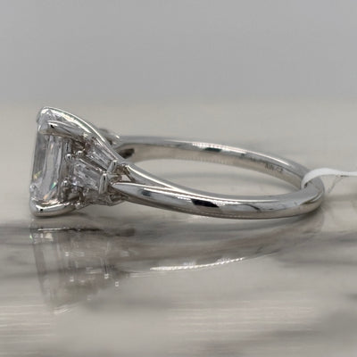 white gold oval engagement ring with tapered baguette side stones