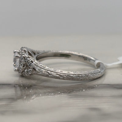 white gold floral inspired engagement ring with halo and accent diamonds