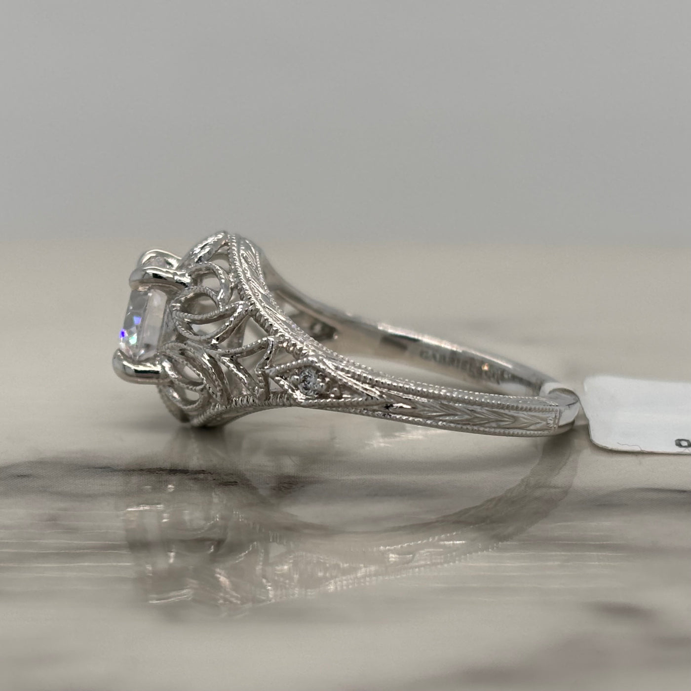 white gold round vintage style filigree engagement ring with milgrain and floral detail