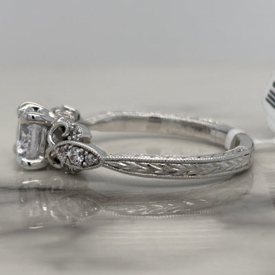 white gold round engagement ring with floral milgrain detail and accent diamonds