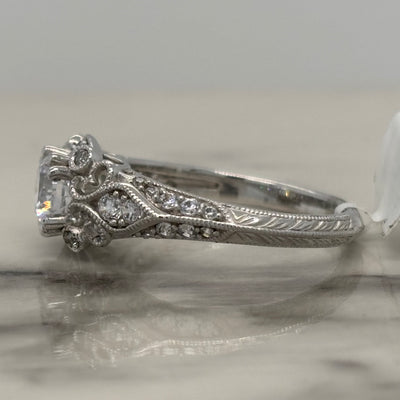white gold vintage style round engagement ring with milgrain detail and diamond accents