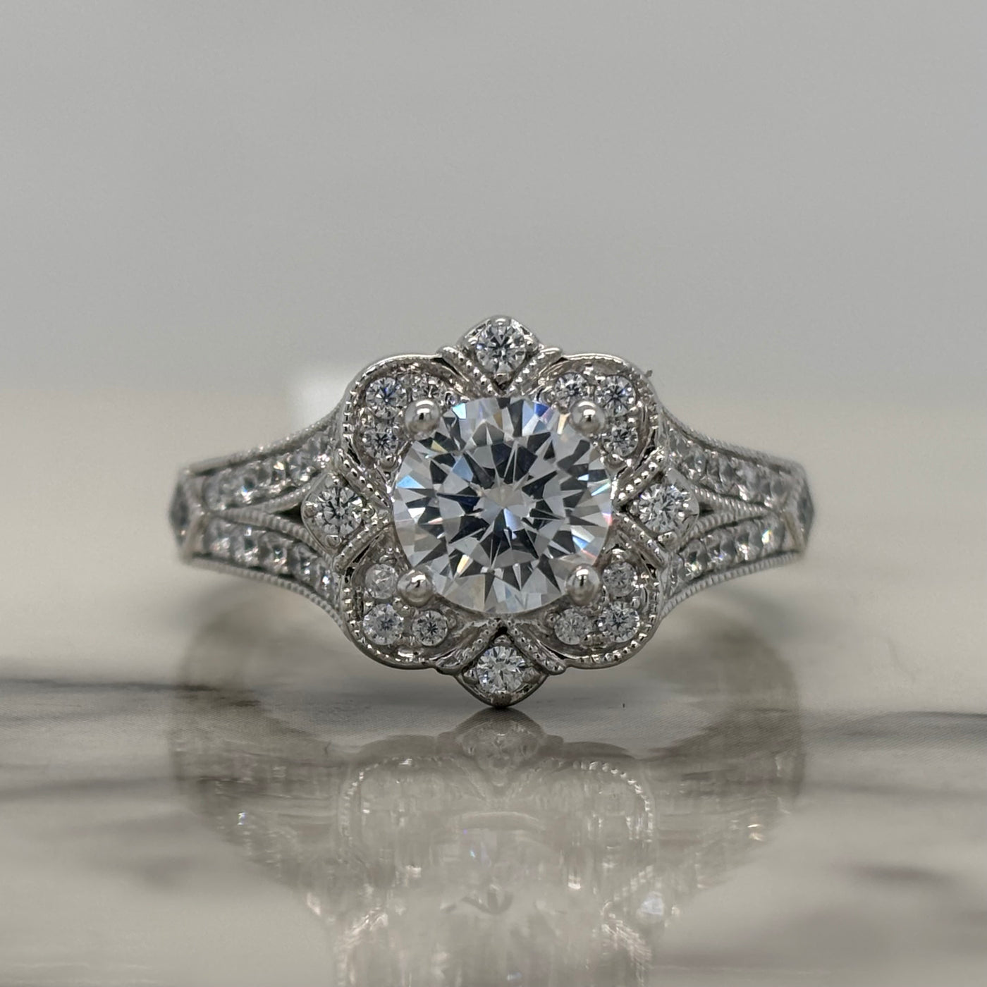 White Gold Round Engagement Ring With Floral Halo and Milgrain Detail