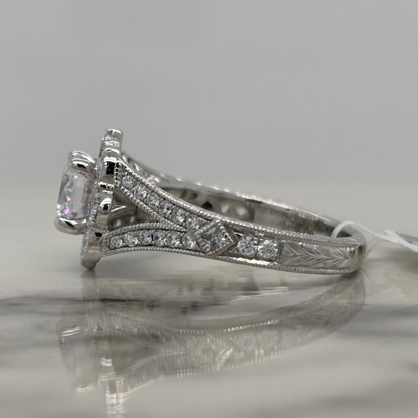 White Gold Round Engagement Ring With Floral Halo and Milgrain Detail