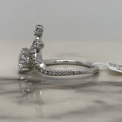 white gold round chevron engagement ring with round accent diamonds
