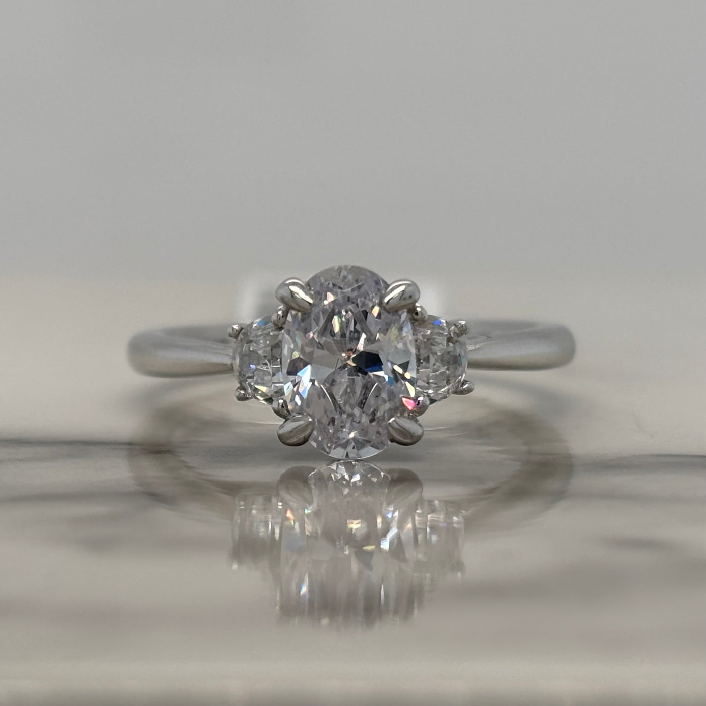 White Gold Oval 3 Stone Engagement Ring With Crescent Side Stones