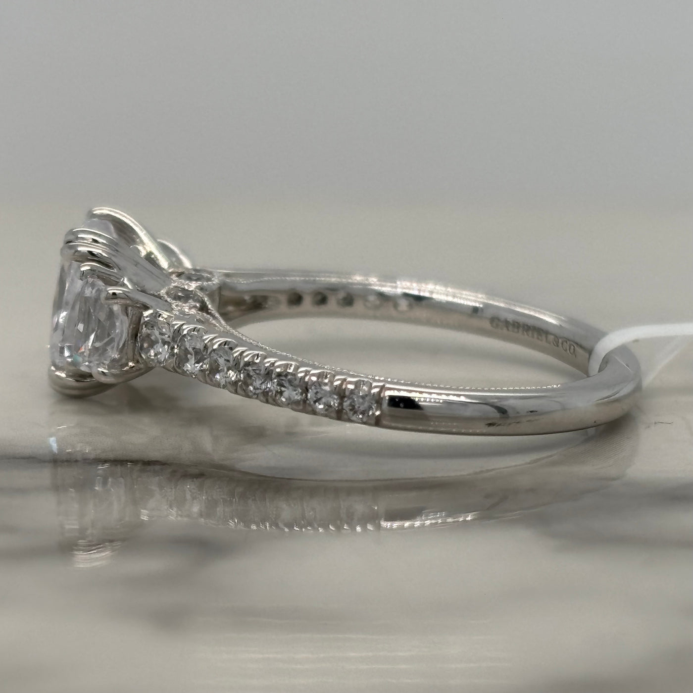White Gold Cushion Cut Engagement Ring With Crescent Side Diamonds and Round Accents
