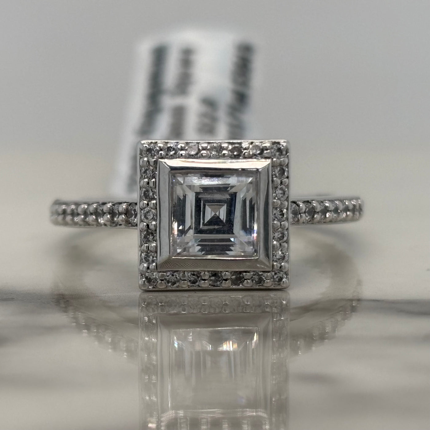 White Gold Princess Cut Bezel Set Engagement Ring With Halo and Accent Diamonds