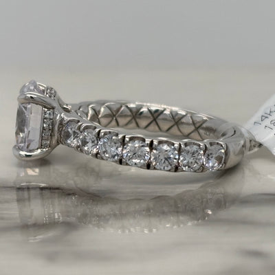 White Gold Round Engagement Ring With Hidden Halo and Round Accent Stones and Quilted Inside Design