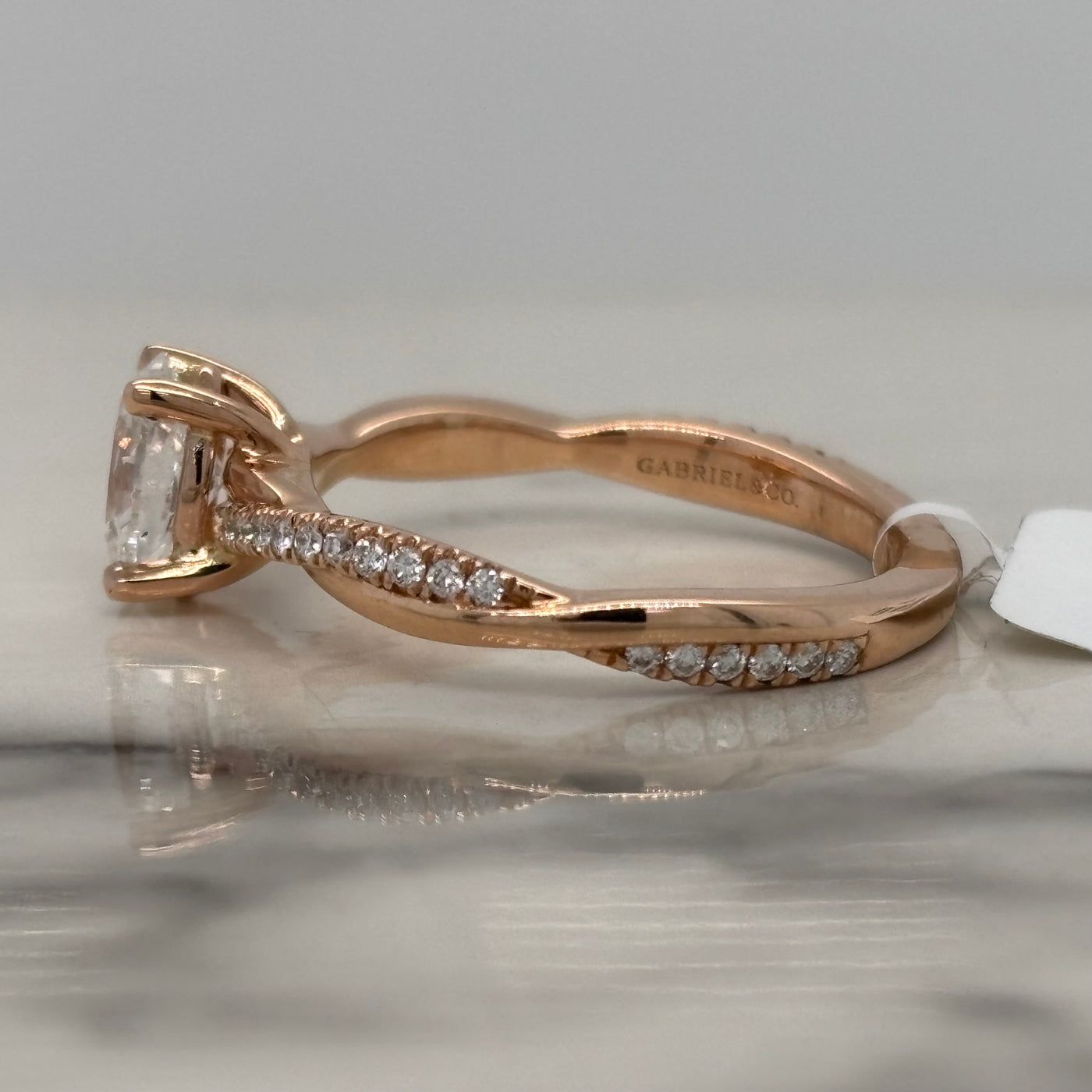Rose Gold Oval Engagement Ring With Twist Design and Accent Diamonds