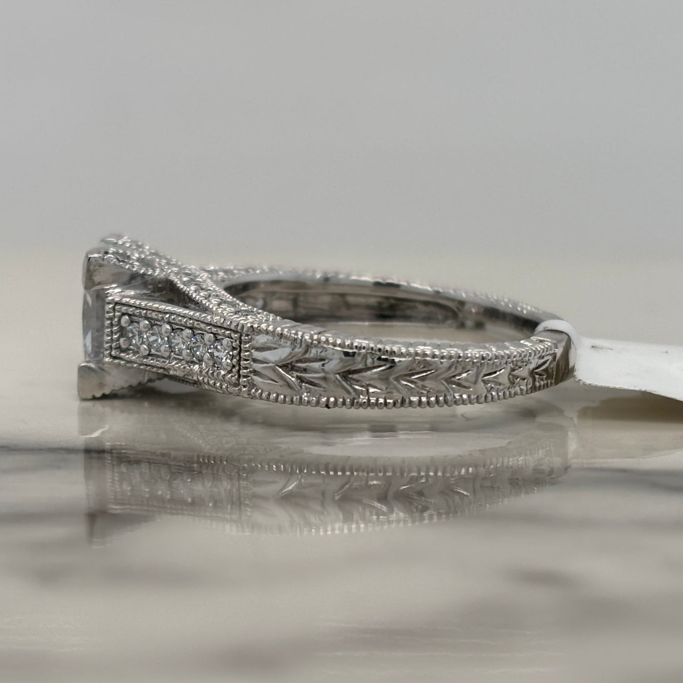 White Gold Princess Cut V-Prong Engagement Ring With Round Accent Diamonds and Milgrain Detail