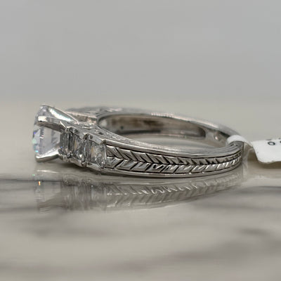 White Gold Round Engagement Ring With Channel Set Princess Cut Side Stones