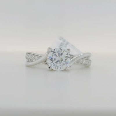 white gold semi mount engagement ring with round diamond accent stones and twist design