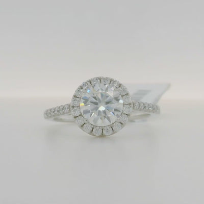 white gold round moissanite engagement ring with halo and side stones