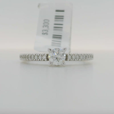 white gold round engagement ring with accent stones