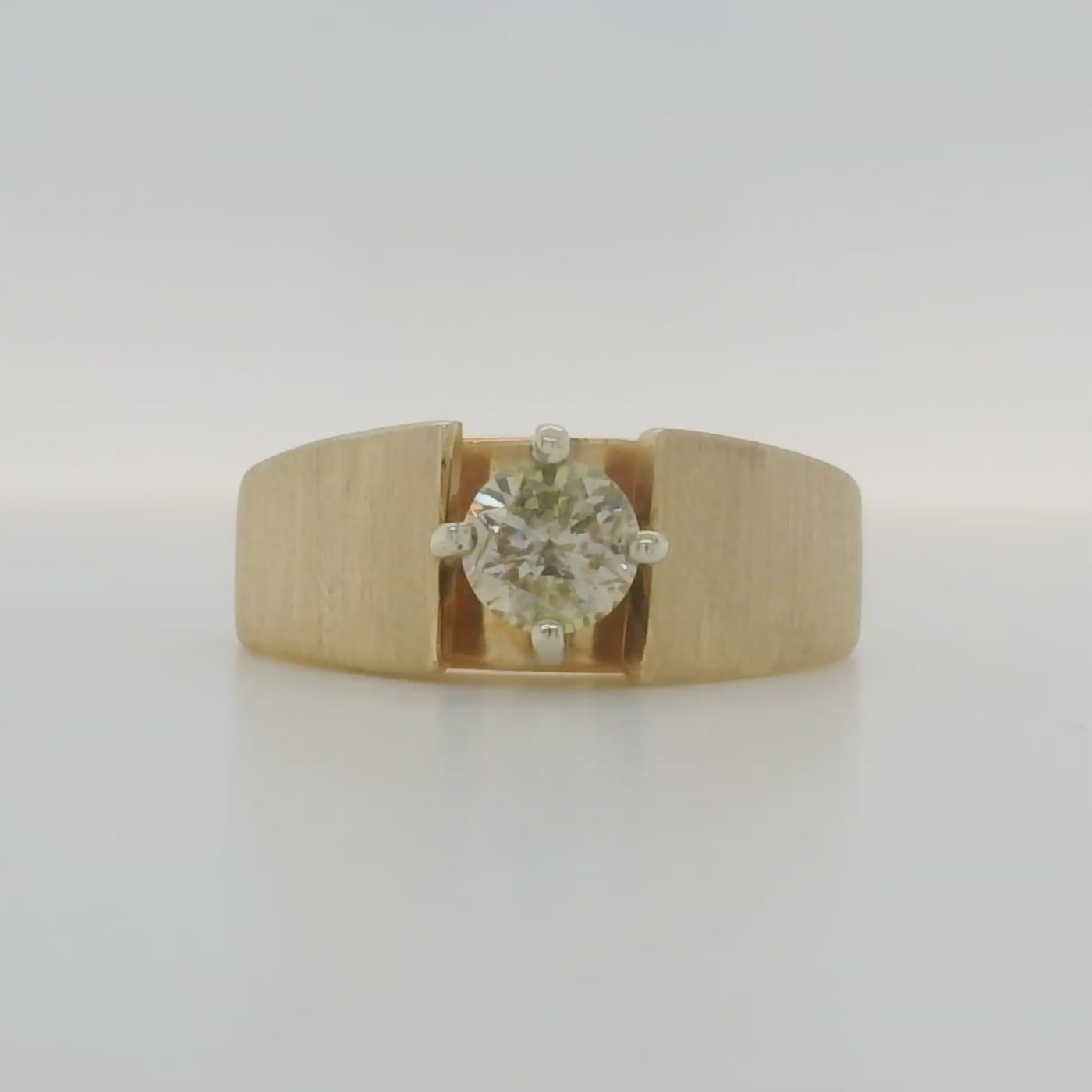 yellow gold round solitaire engagement ring with brushed finish