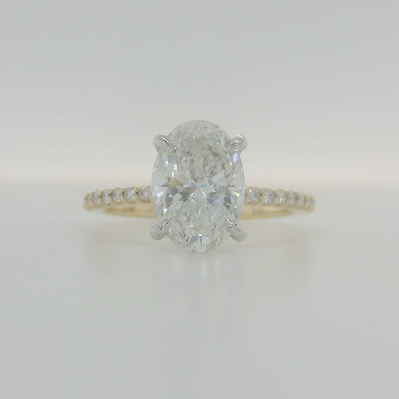Yellow Gold Oval Diamond Engagement Ring With Hidden Halo